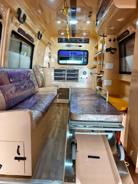 Ambulance interior with stretcher and seating for family